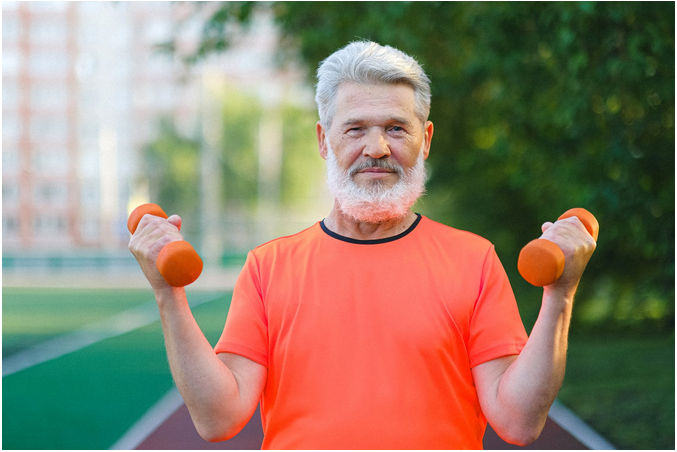 a man above 50 working out withe weights