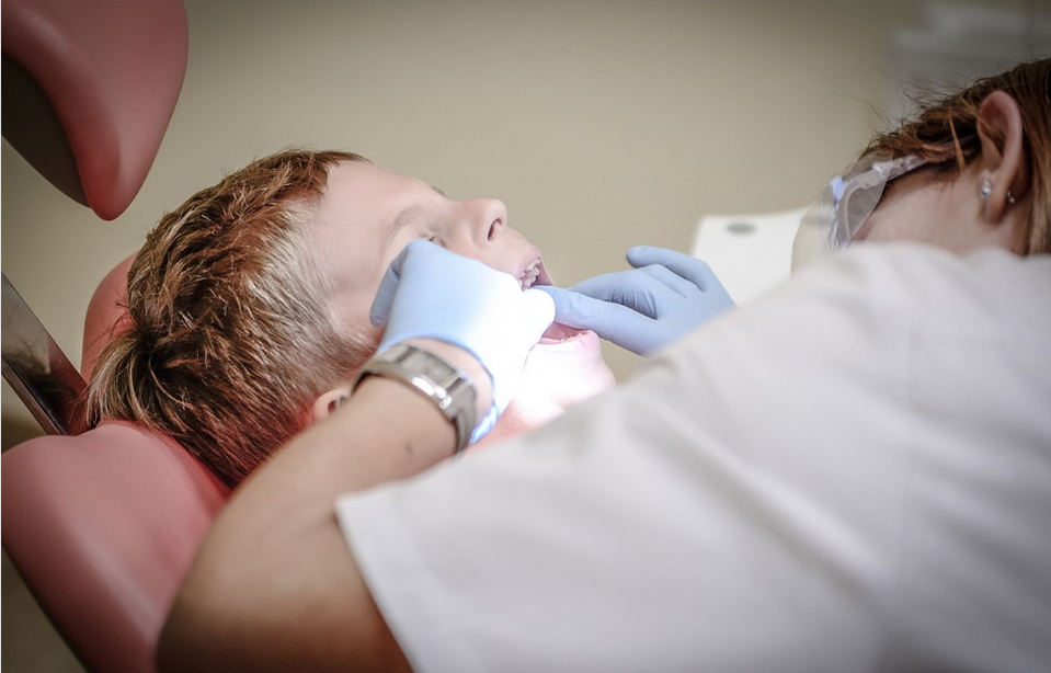 a dentist attending a patient